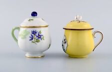 Two antique cream cups in hand-painted porcelain. Early 20th century. picture