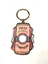 Press For Champagne Peach Color Metal Keychain picture