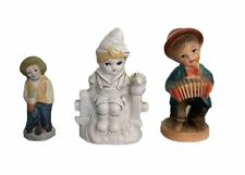 To Asian boy and Asian man figurine picture