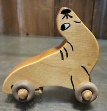 PRIMATIVE VINTAGE WOODEN SEA LION SEAL ON  WHEELS CHRISTMAS ORNAMENT TOY picture