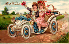 1908 Best Wishes Gold Tone Embossed Postcard 2 Girls Driving Horseless Carriage  picture