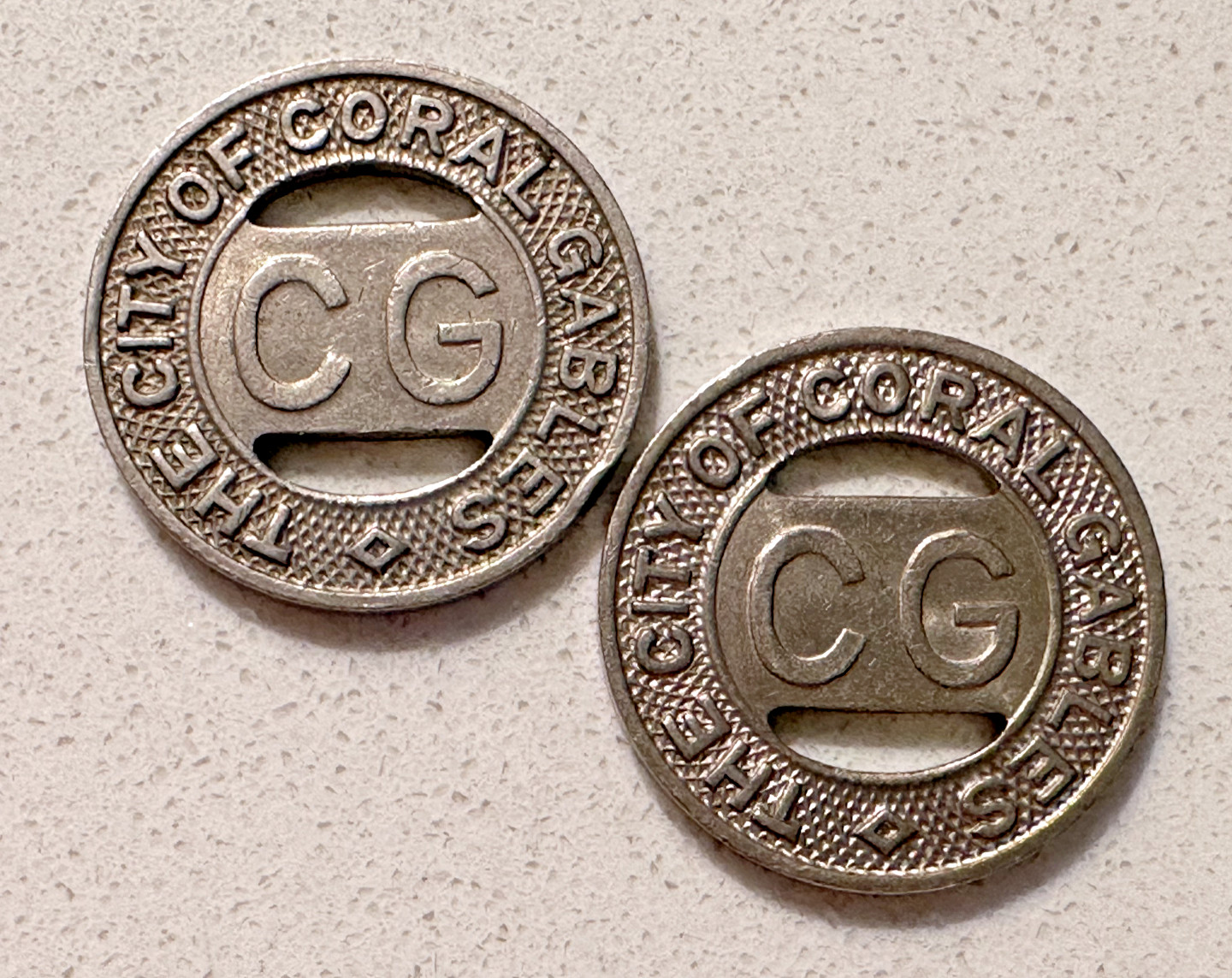 TWO VINTAGE CITY OF CORAL GABLES 1/2 INTERURBAN OR 1 LOCAL FARE TRANSIT TOKENS