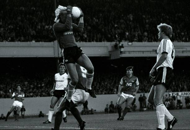 Manchester United goalkeeper Gary Bailey saves from Arsenal\'s Tony- Old Photo