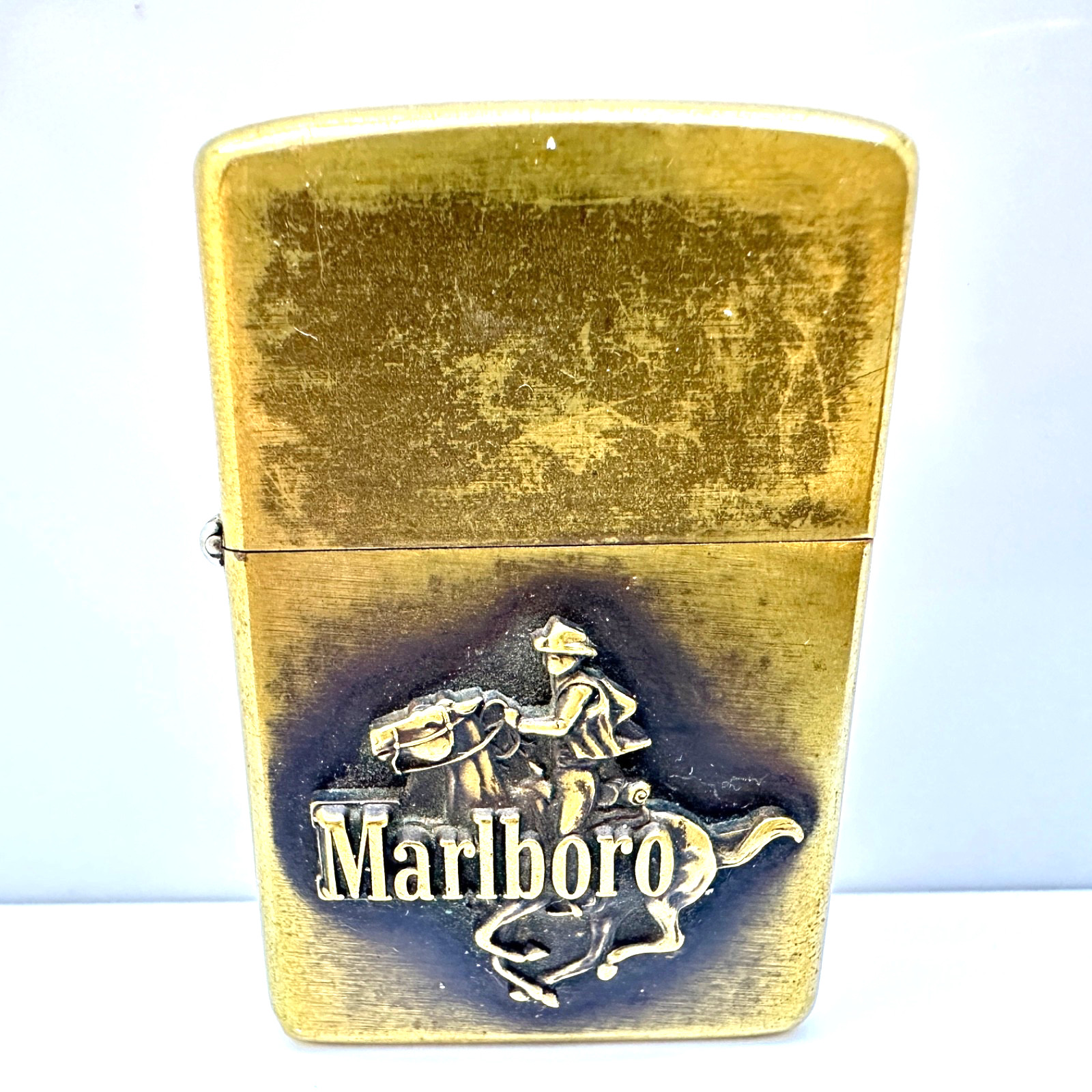 RARE VINTAGE 1984 c. MARLBORO ZIPPO RIDING COWBOY BRASS LIGHTER