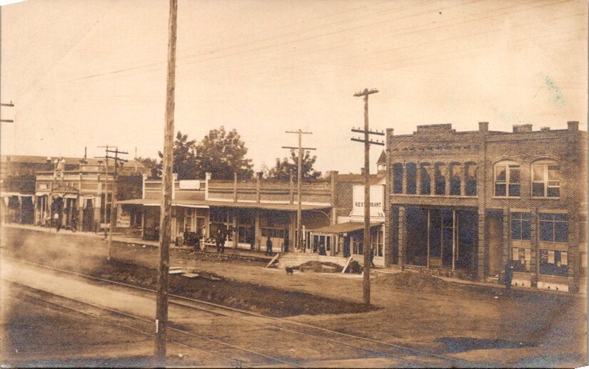 RPPC Postcard Main Street in Town Restaurant Train Tracks c.1904-1920s     12577