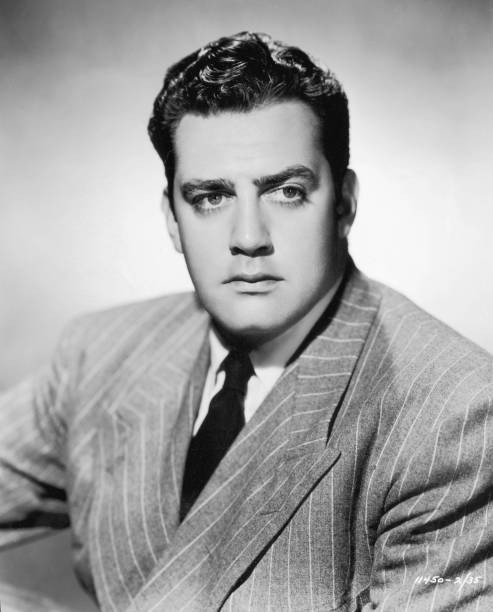 Canadian actor Raymond Burr wears a pinstriped suit a promotional h- Old Photo