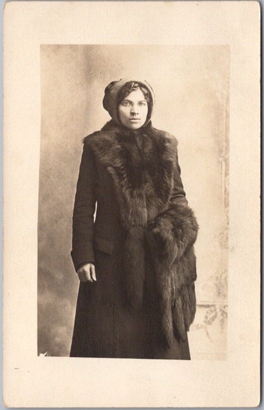 c1910s STUDIO Photo RPPC Postcard Young Woman in Winter Coat & Glasses /Fur Muff