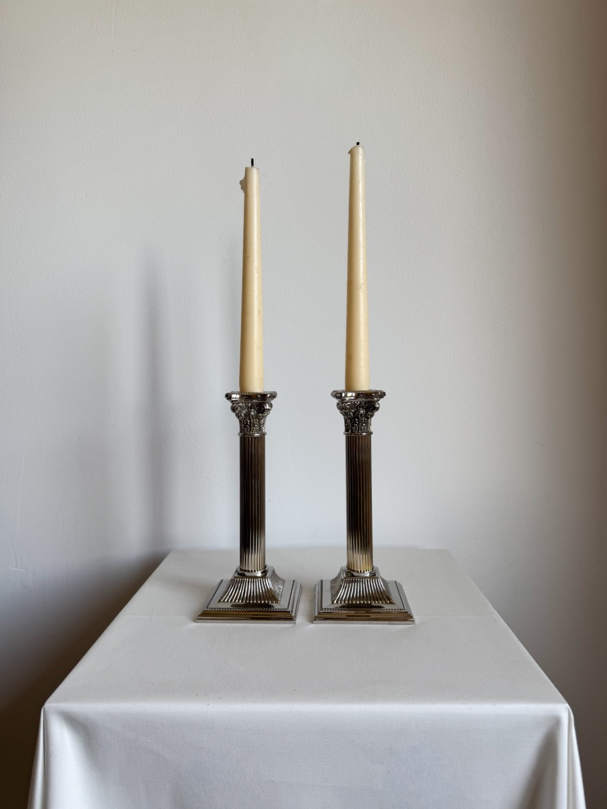 A Pair Of Vintage Silver Plated Corinthian Column Candle Holders