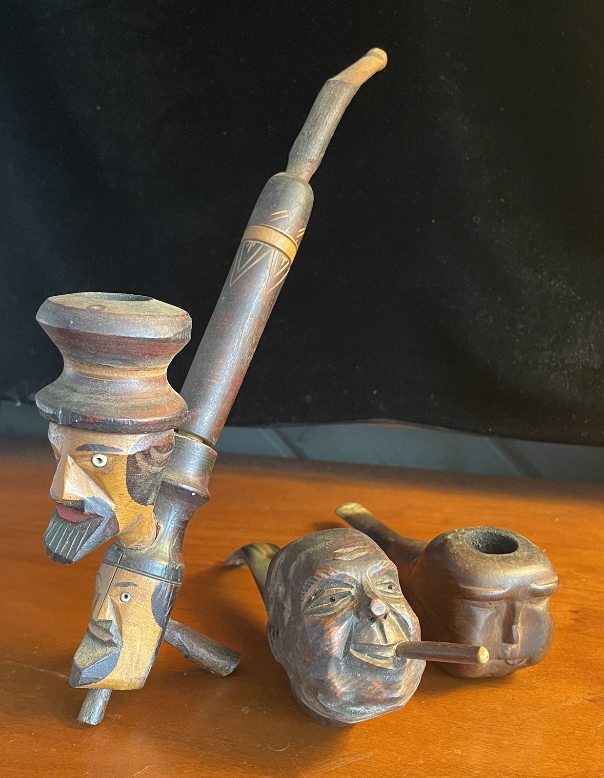 Three Vintage Carved Wooden Pipes, Double and Single Head Figures Three Vintage Carved Wooden Pipes, Double and Single Head Figures