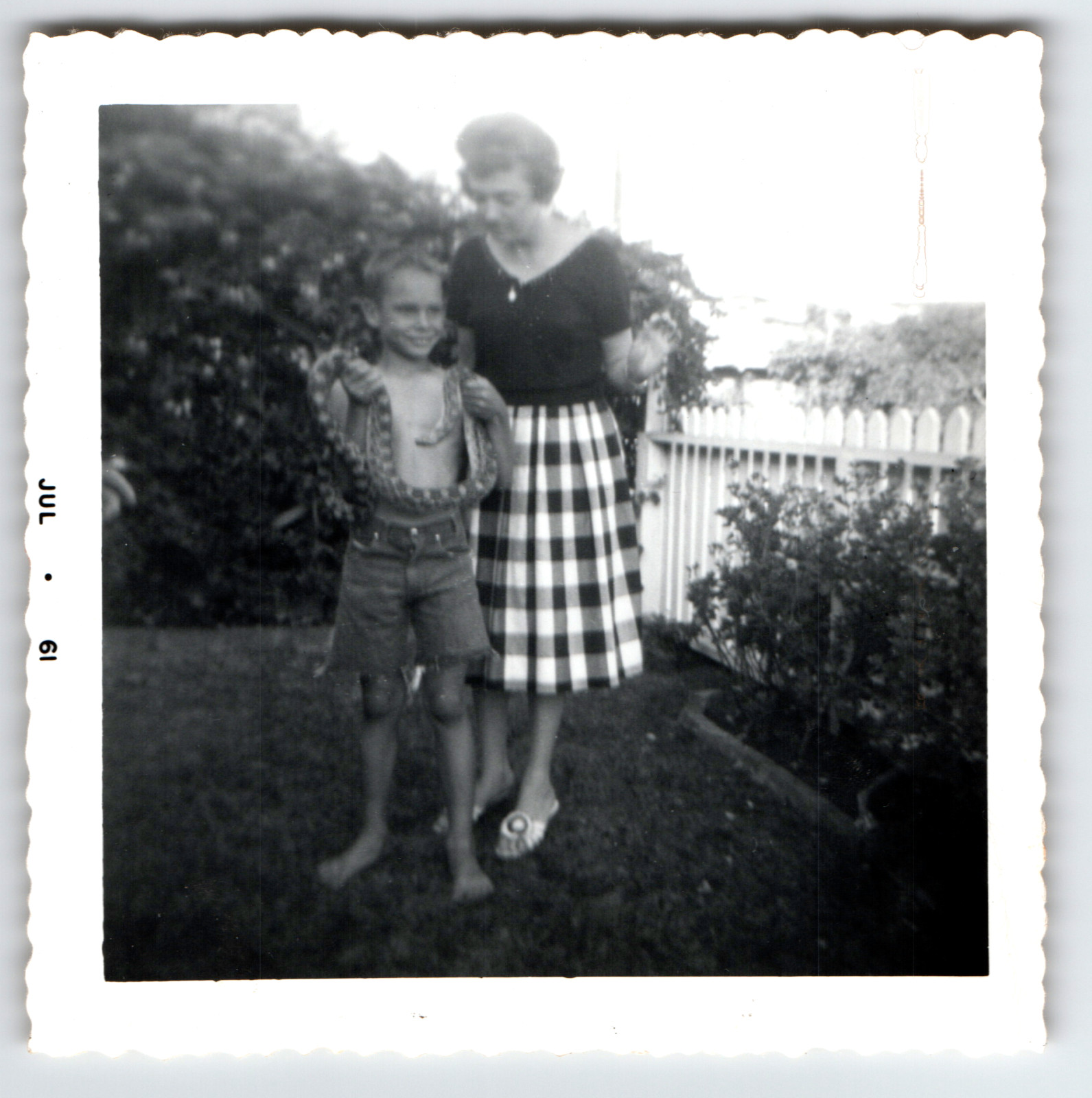 Photo Boy Holding Large Snake Next To Mother Backyard Vintage 1961