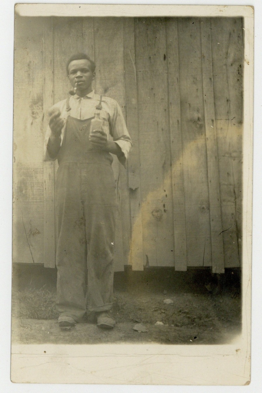 African American Man 1900 Smoking Pipe, Bottle, Outhouse RPPC Black Rural Poor African American Man 1900 Smoking Pipe, Bottle, Outhouse RPPC Black Rural Poor