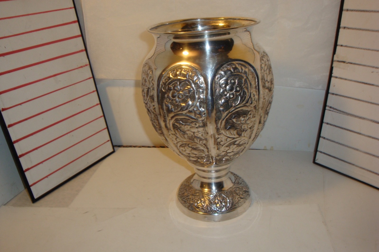 Vintage Anglo- Raj style silvered footed vase embossed floral  & vine pattern
