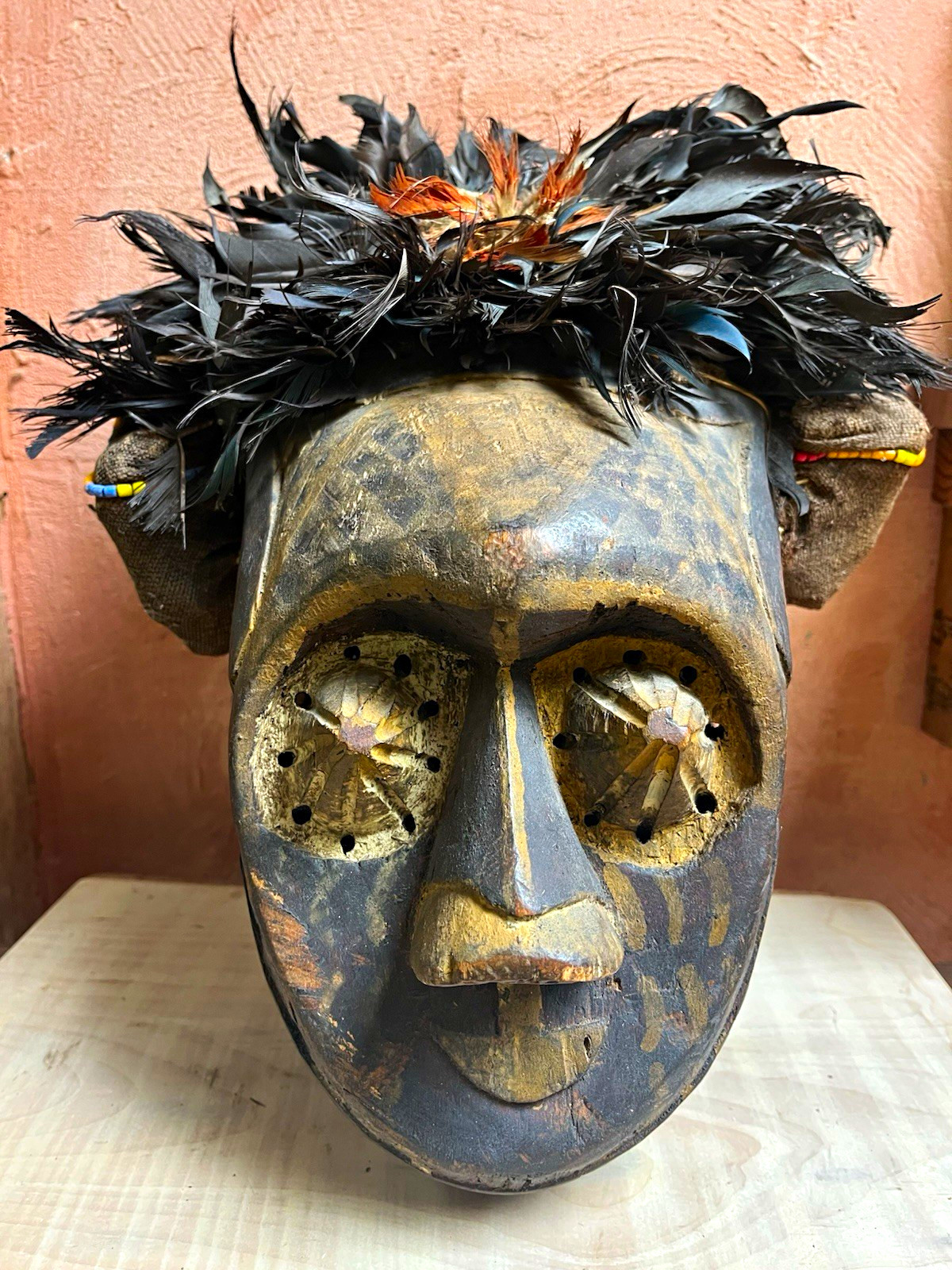 Carved Wooden African Kuba Mask w/ Feather Headdress, Beaded Trim & Fabric Carved Wooden African Kuba Mask w/ Feather Headdress, Beaded Trim & Fabric