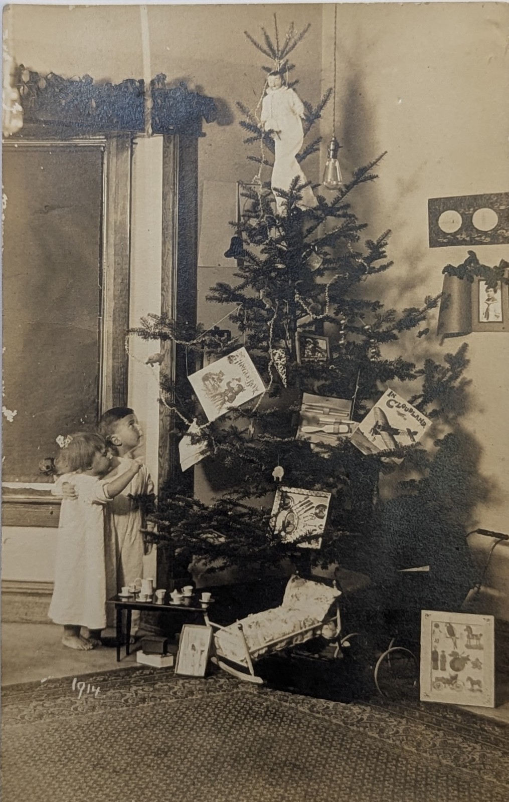 Vintage Christmas 1914 RPPC Postcard Children Nightgowns Toys Tree Cradle Books