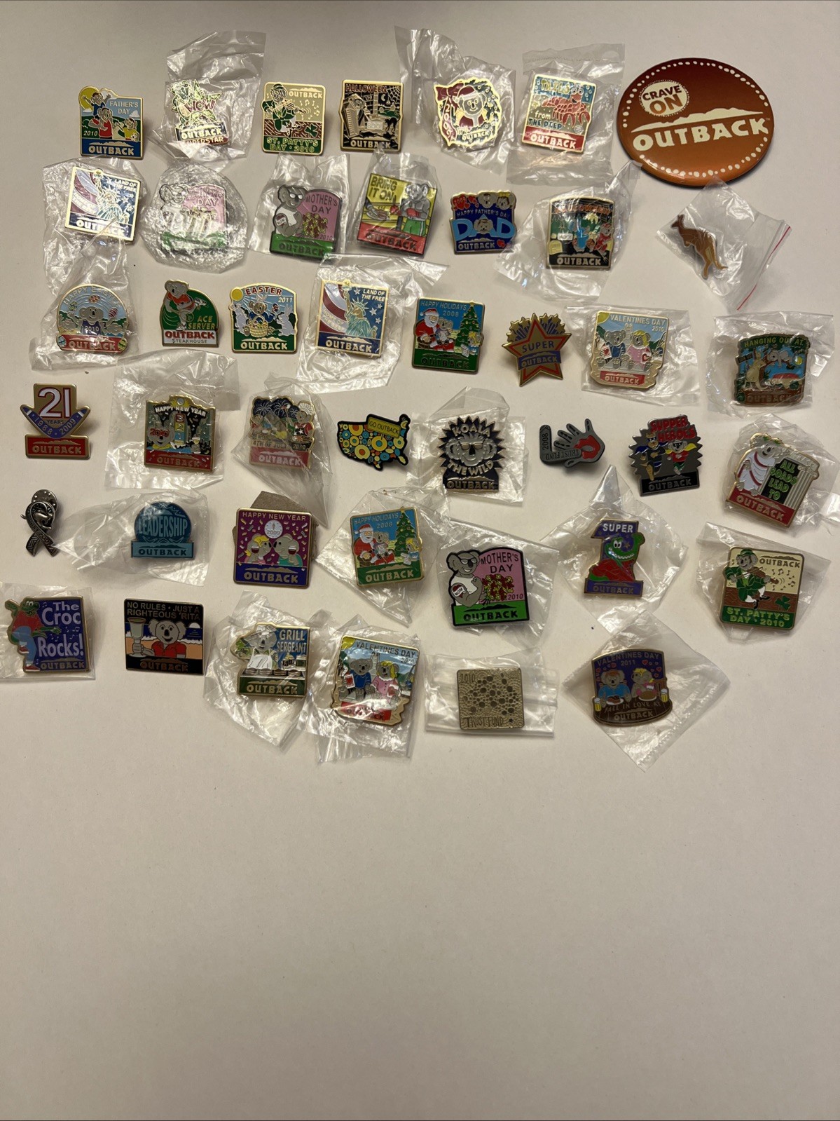 Lot of 42 Vintage Outback Steakhouse Lapel Pins Outbackers Some Sealed