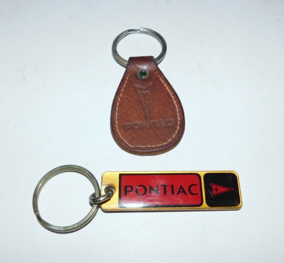 2 NEAT VINTAGE PONTIAC CAR KEYCHAINS 2 NEAT VINTAGE PONTIAC CAR KEYCHAINS