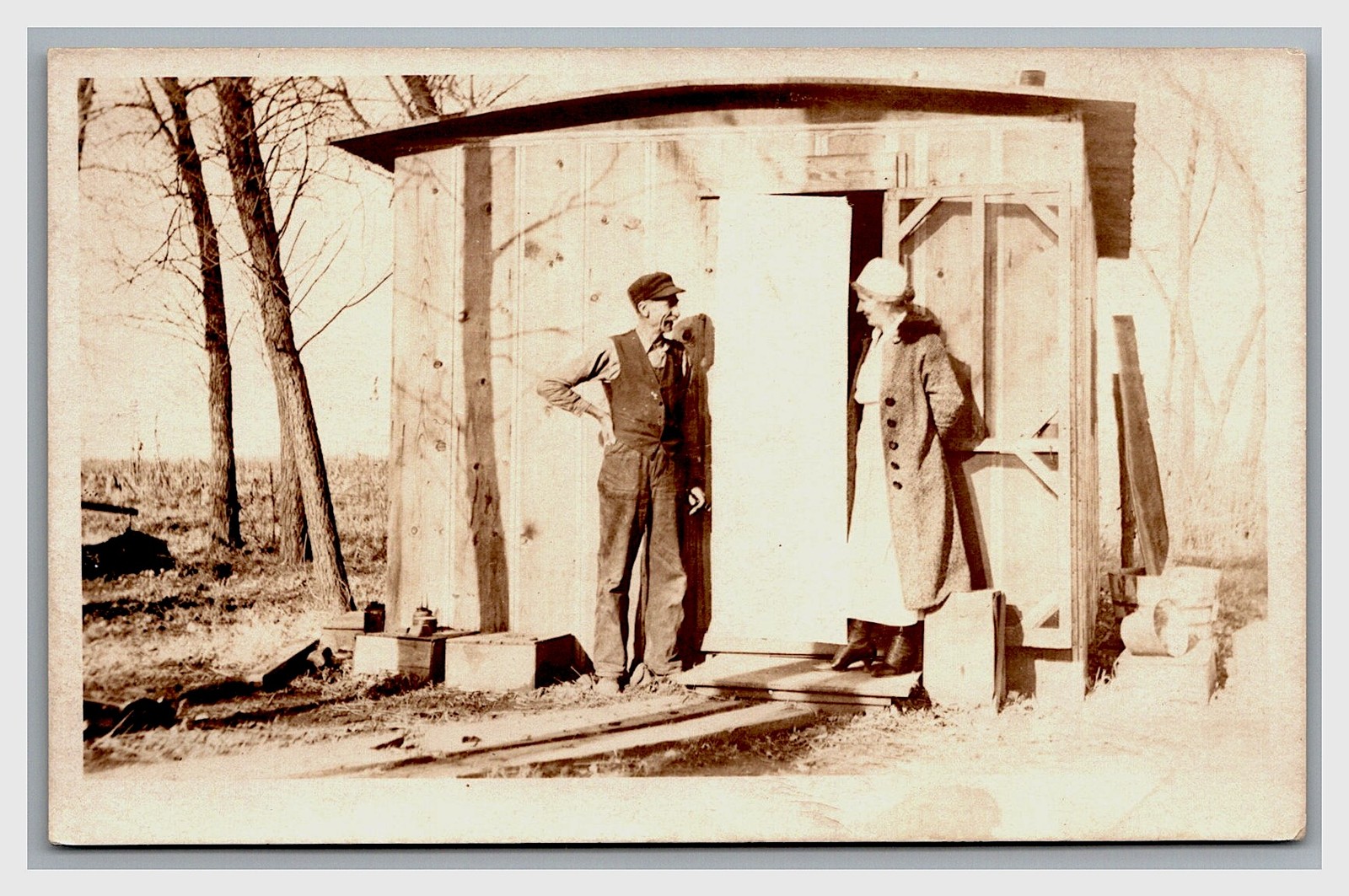 RPPC ~ Worker at barn shed w Wife or client ~ Occupational farm scene RPPC ~ Worker at barn shed w Wife or client ~ Occupational farm scene