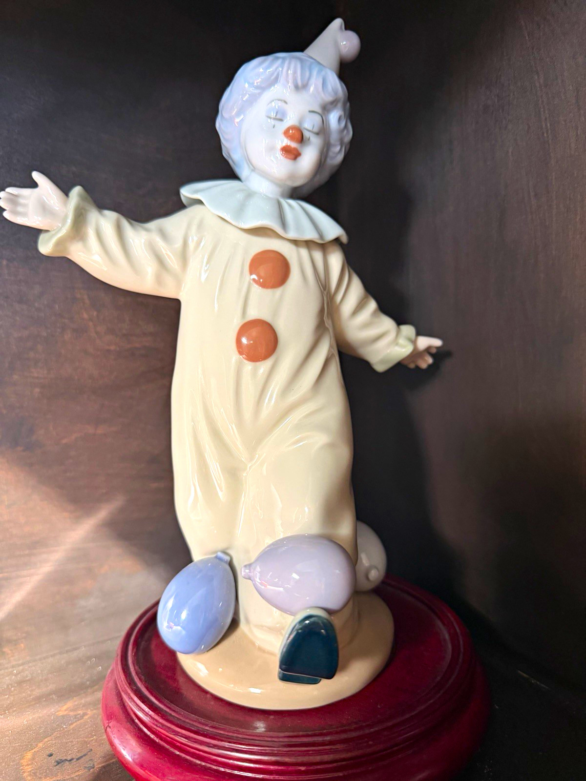 Nadal collectible porcelain Clown Figurine on wood  Base, balances balloons.
