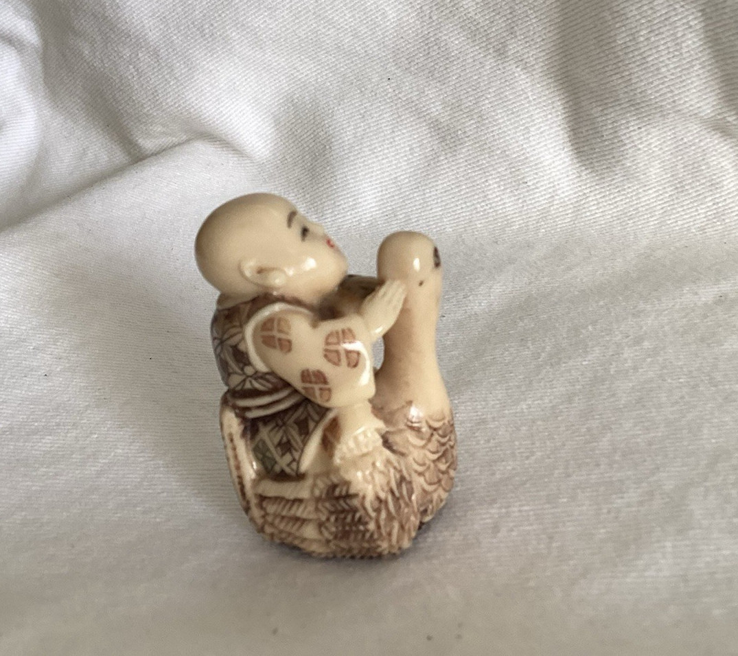 Vintage Netsuke-Style Figurine of a Monk Riding on a Goose Vintage Netsuke-Style Figurine of a Monk Riding on a Goose