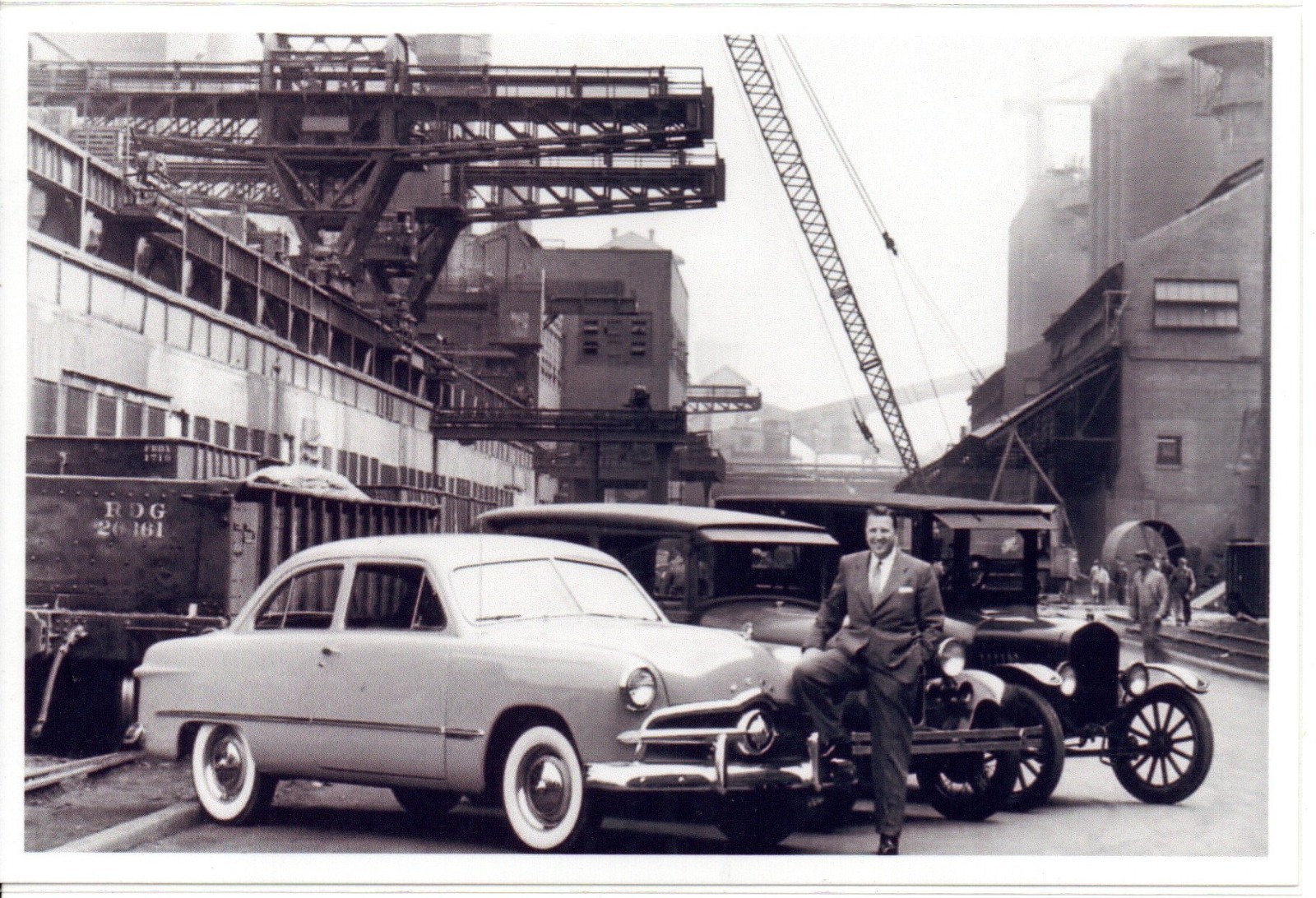 Henry Ford II Posing with 1950 Ford Model A and Model T Fords Photo