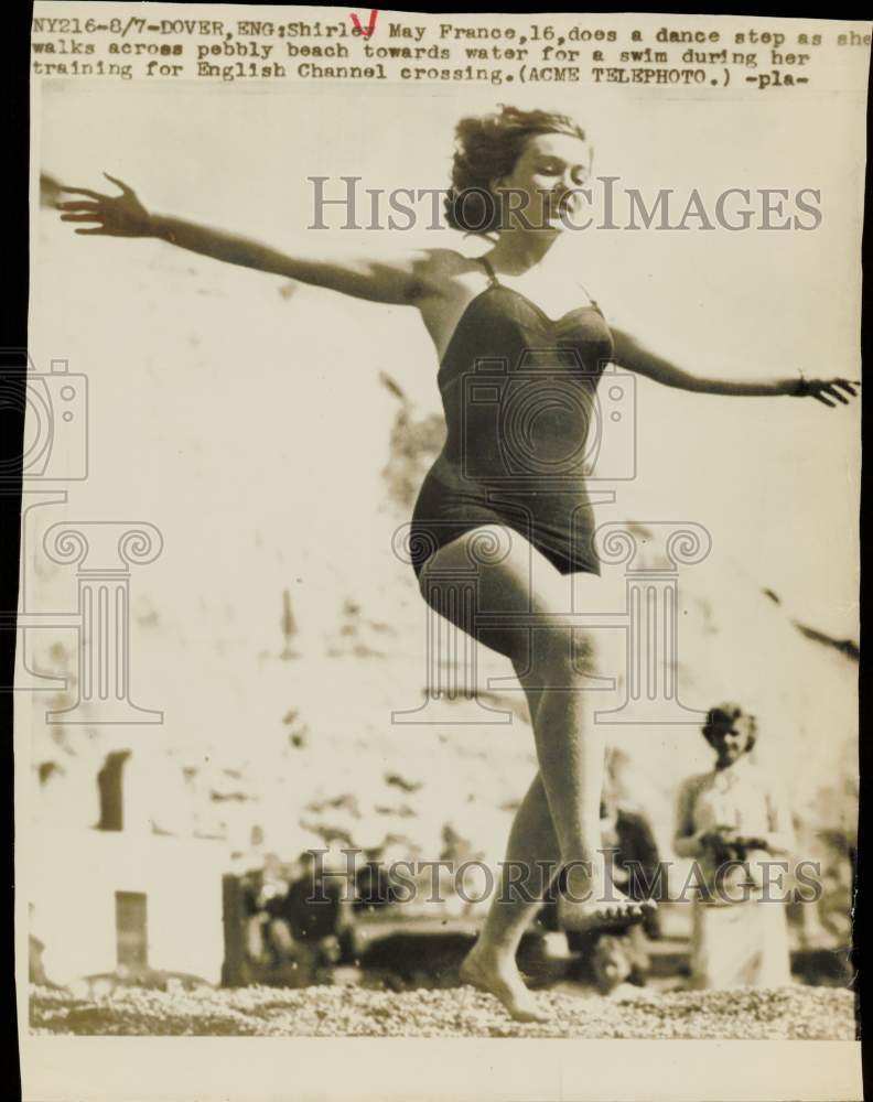 1949 Press Photo Shirley May France walks across pebbly beach in Dover, England 1949 Press Photo Shirley May France walks across pebbly beach in Dover, England