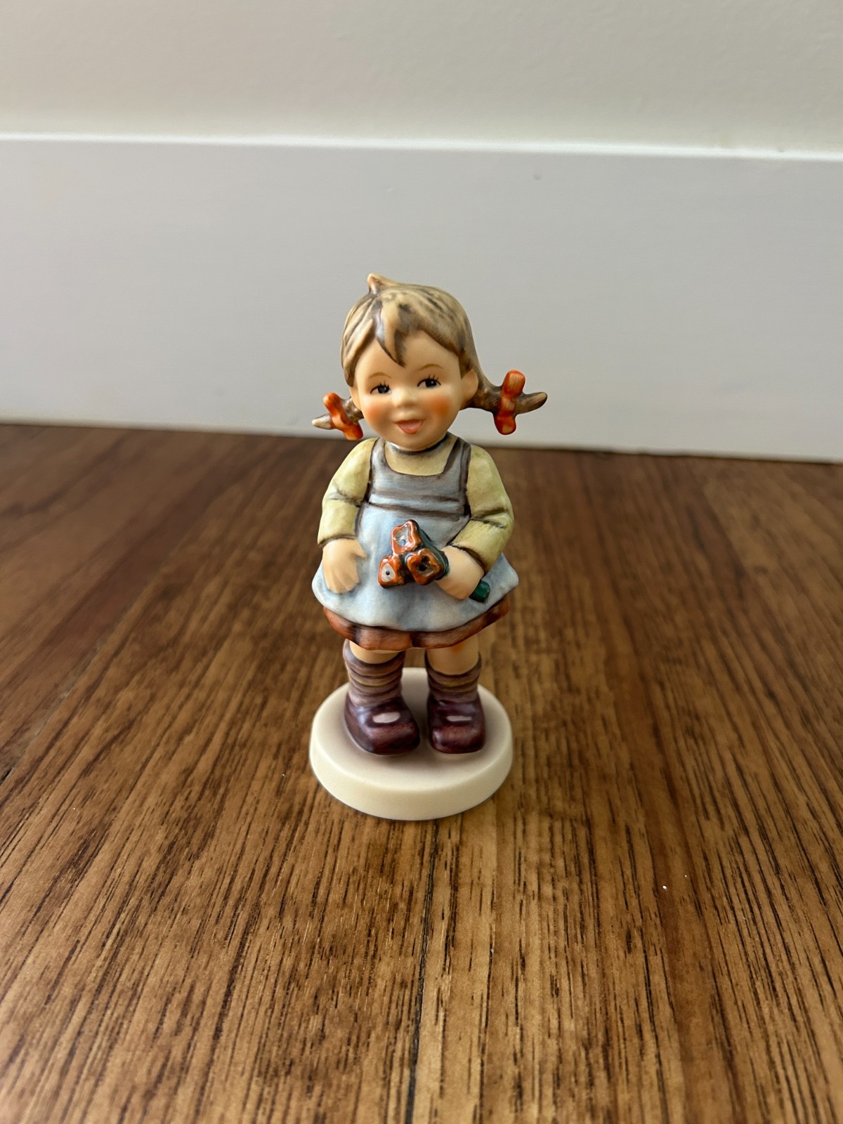 Goebel M.I. Hummel porcelain figurine titled Goebel M.I. Hummel porcelain figurine titled