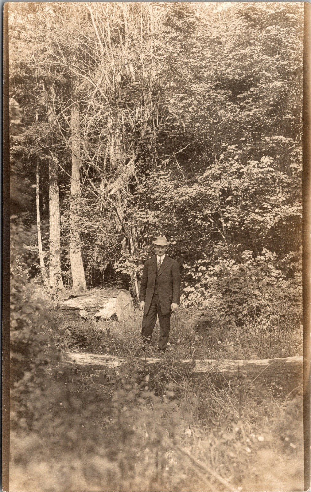 Postcard Real Photo RPPC Man Wearing Hat Standing on Wooded Lot Unposted