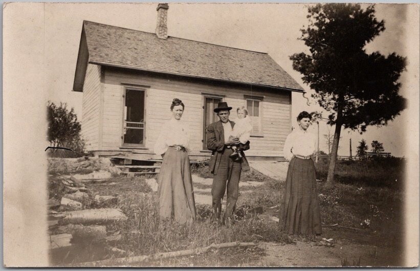 Vintage 1910s Real Photo RPPC Postcard Family Posing in Front of Small House