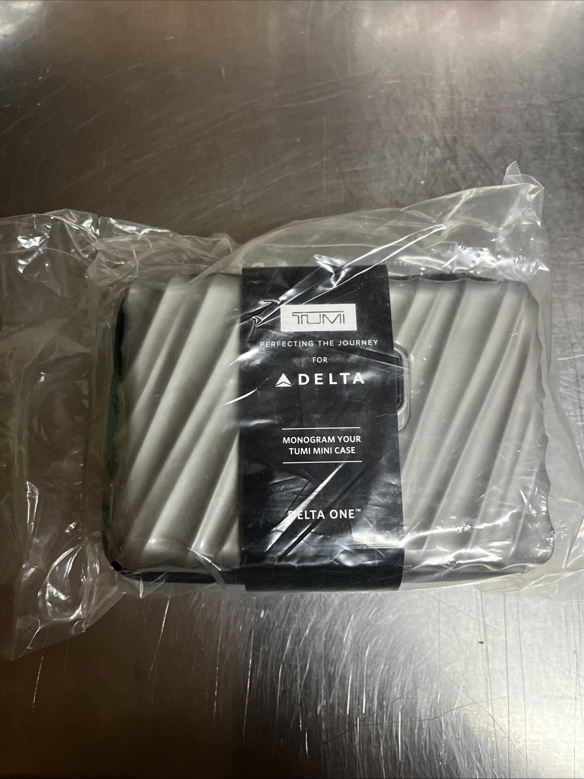 NIP Delta One Amenity Kit - TUMI Hard Shell Grey - Monogramable
