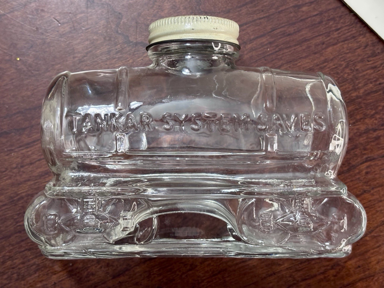 Clear Glass Railroad Tank Car Savings Bank Jar w/ Embossed Lettering & Lid Clear Glass Railroad Tank Car Savings Bank Jar w/ Embossed Lettering & Lid