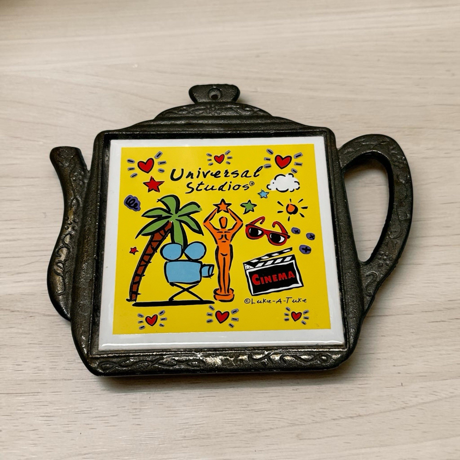 Vintage Universal Studios Luke-a-tuke Teapot Shaped Cast Iron Tile Trivet