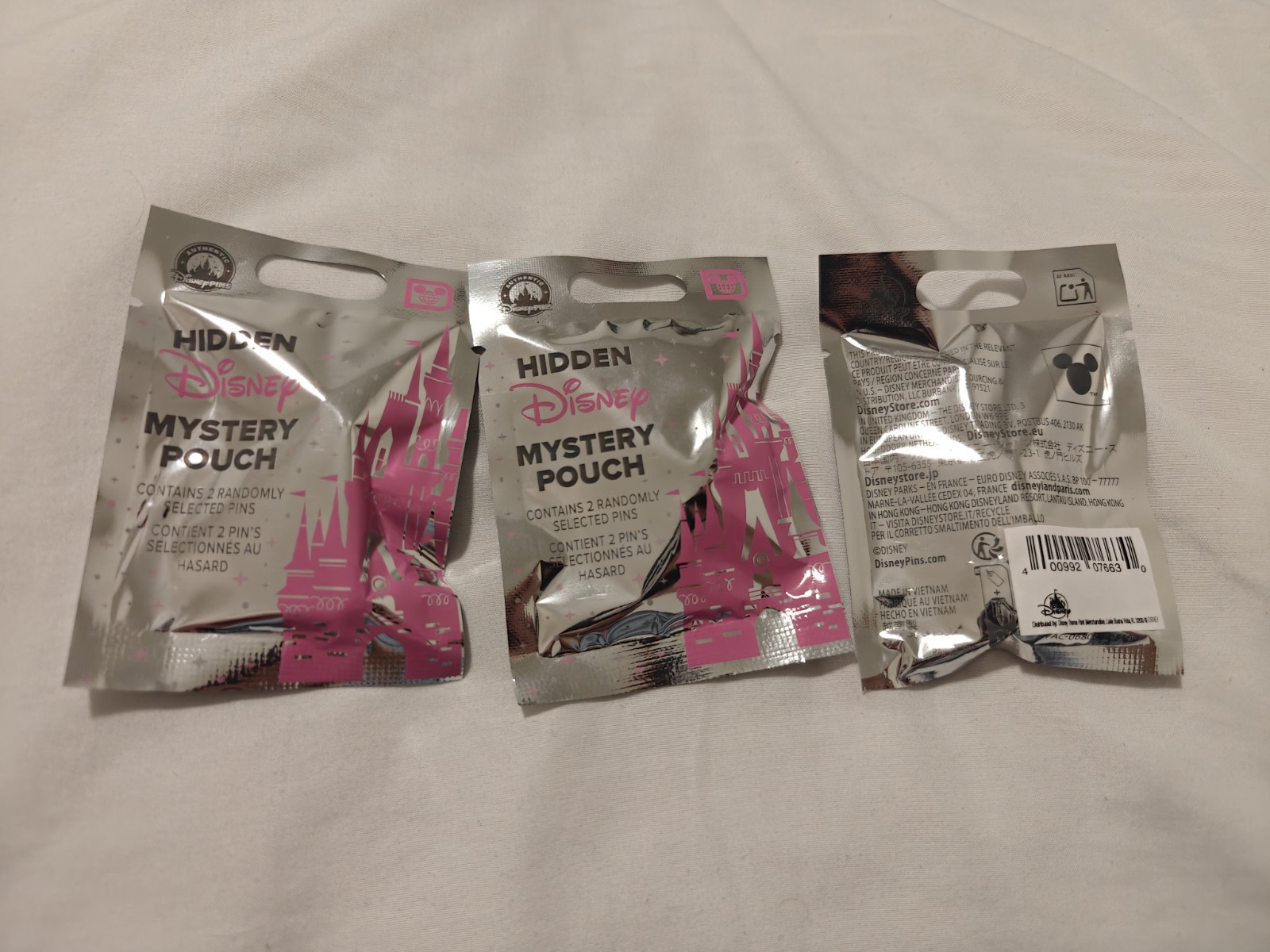 Lot of 3 Disneyland Hidden Disney Mystery Pin Pouches Pink Castle Sealed NEW Lot of 3 Disneyland Hidden Disney Mystery Pin Pouches Pink Castle Sealed NEW