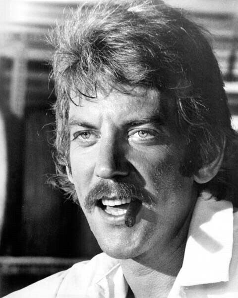 Donald Sutherland smiles as he smokes cigar 1973 Lady Ice 8x10 inch photo Donald Sutherland smiles as he smokes cigar 1973 Lady Ice 8x10 inch photo