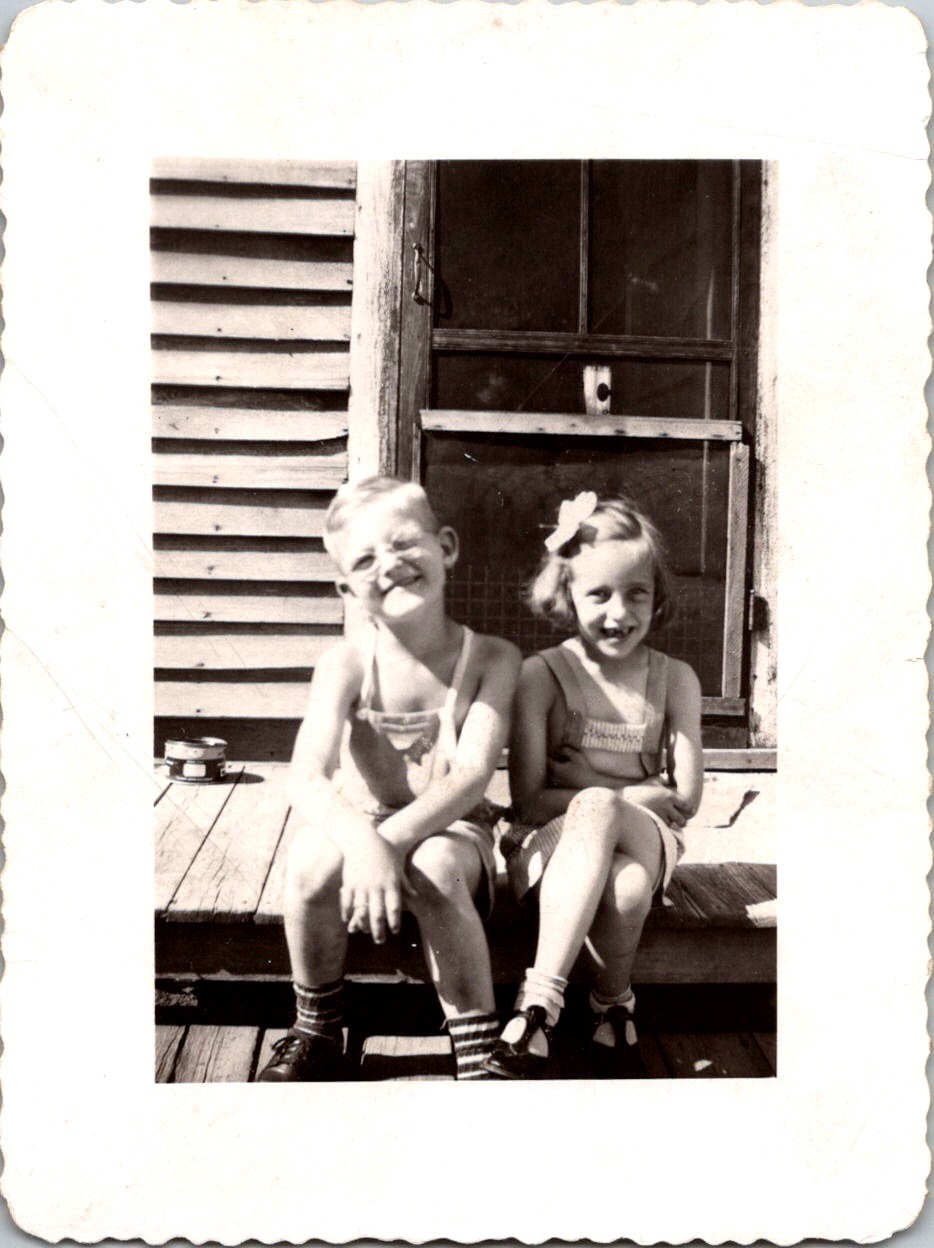 Two Smiling Children on Porch, 1940s B&W Snapshot Photo Two Smiling Children on Porch, 1940s B&W Snapshot Photo
