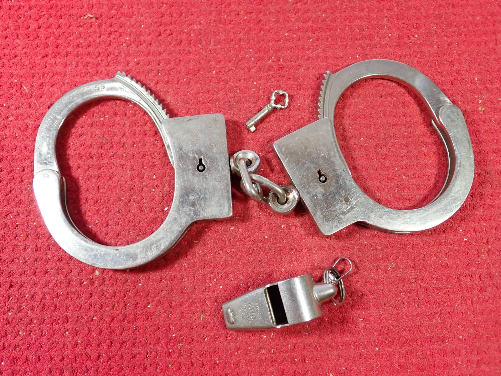 Vintage Pre 1962 American Munitions Handcuffs & H. W. C. Brass Whistle Vintage Pre 1962 American Munitions Handcuffs & H. W. C. Brass Whistle