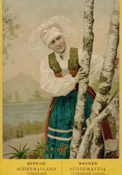 Coloured portrait photograph of a woman looking out from behind bi- Old Photo