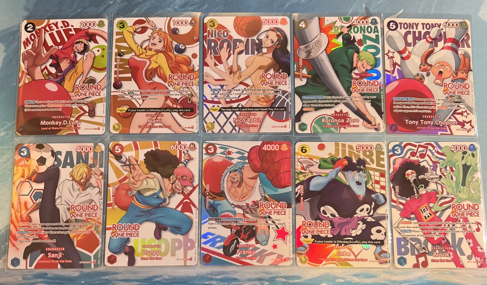Round 1 x One Piece Promo Cards - Full Set of 10 English + 2 Keychains Round 1 x One Piece Promo Cards - Full Set of 10 English + 2 Keychains