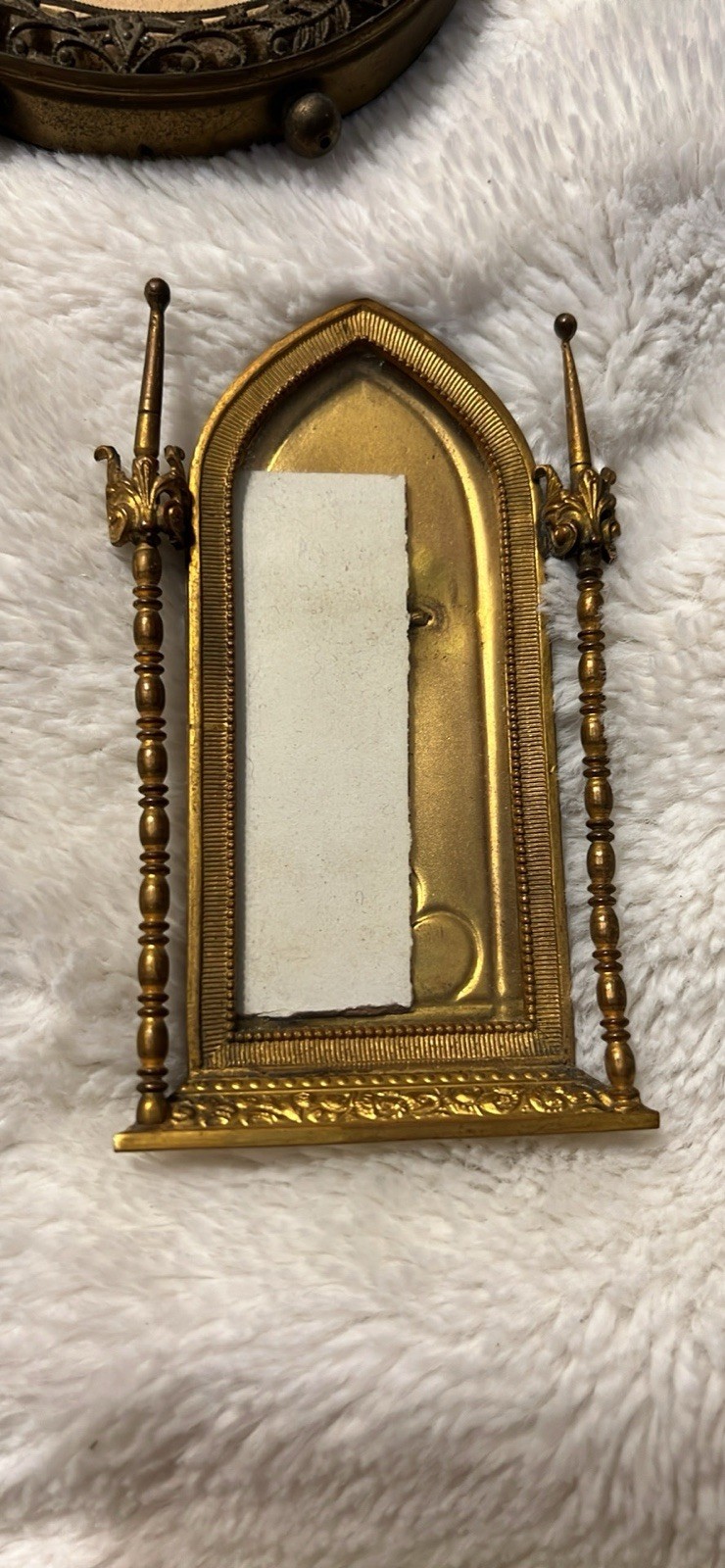 Gothic Revival architectural frame, resembling a tabernacle or cathedral arch