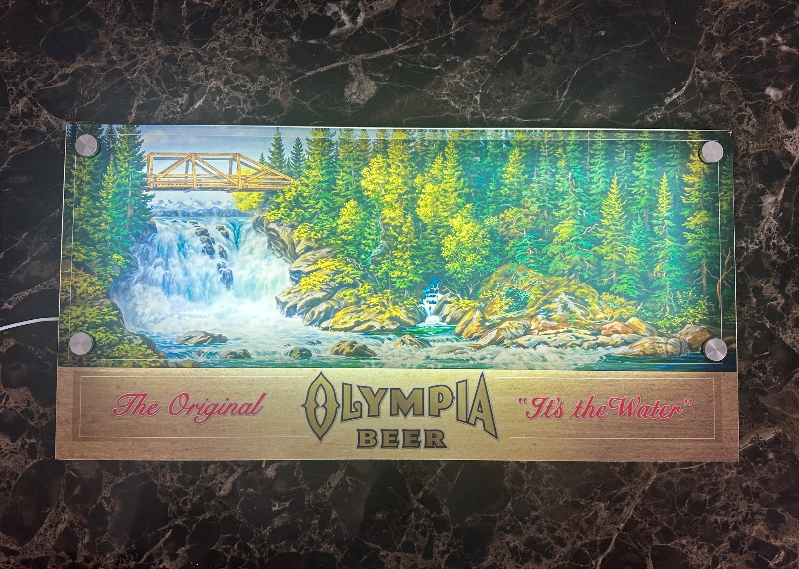 Classic Olympia Beer sign with waterfall scene 12
