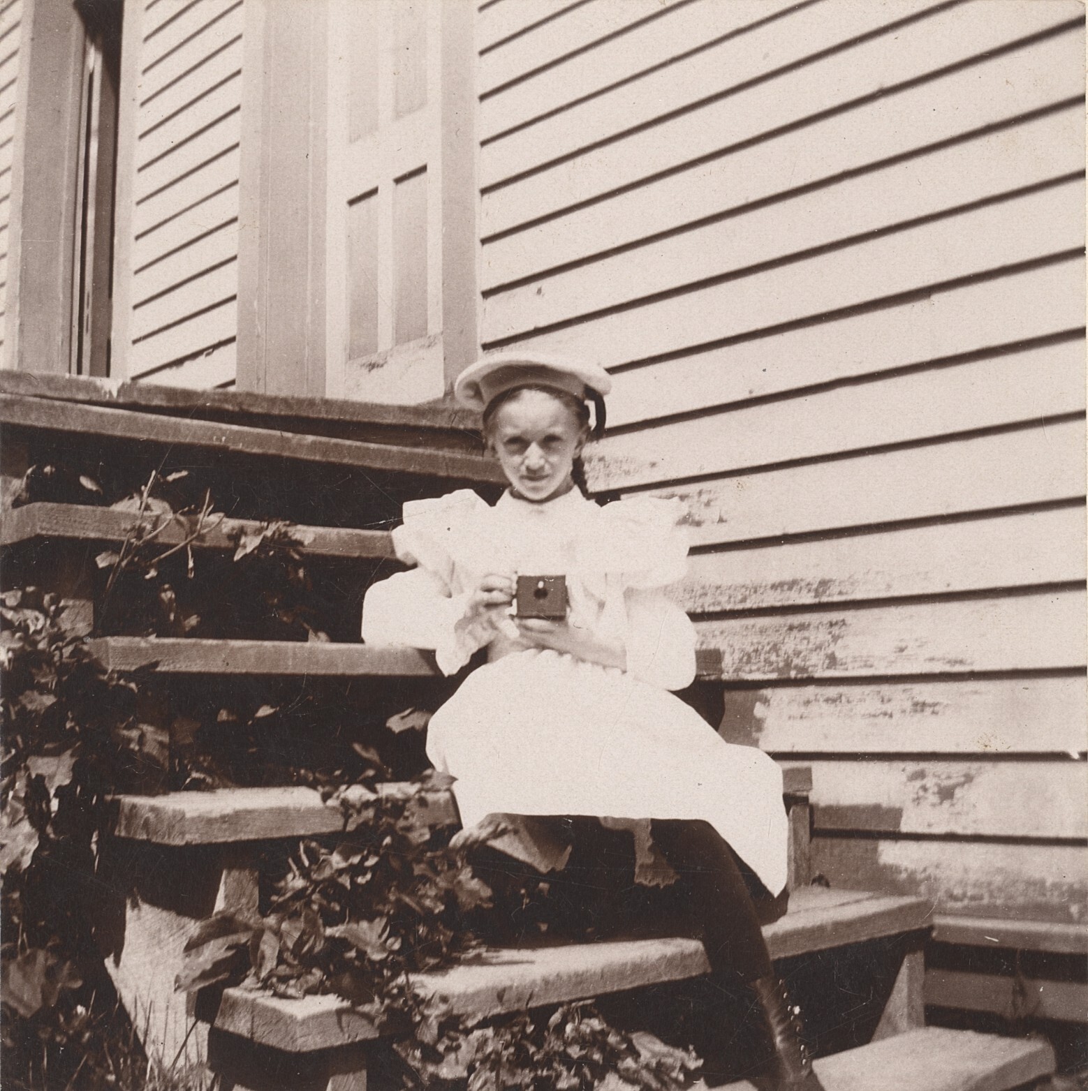 c. 1900 Young Girl Photographer Sitting on Stoop Cabinet Photograph c. 1900 Young Girl Photographer Sitting on Stoop Cabinet Photograph