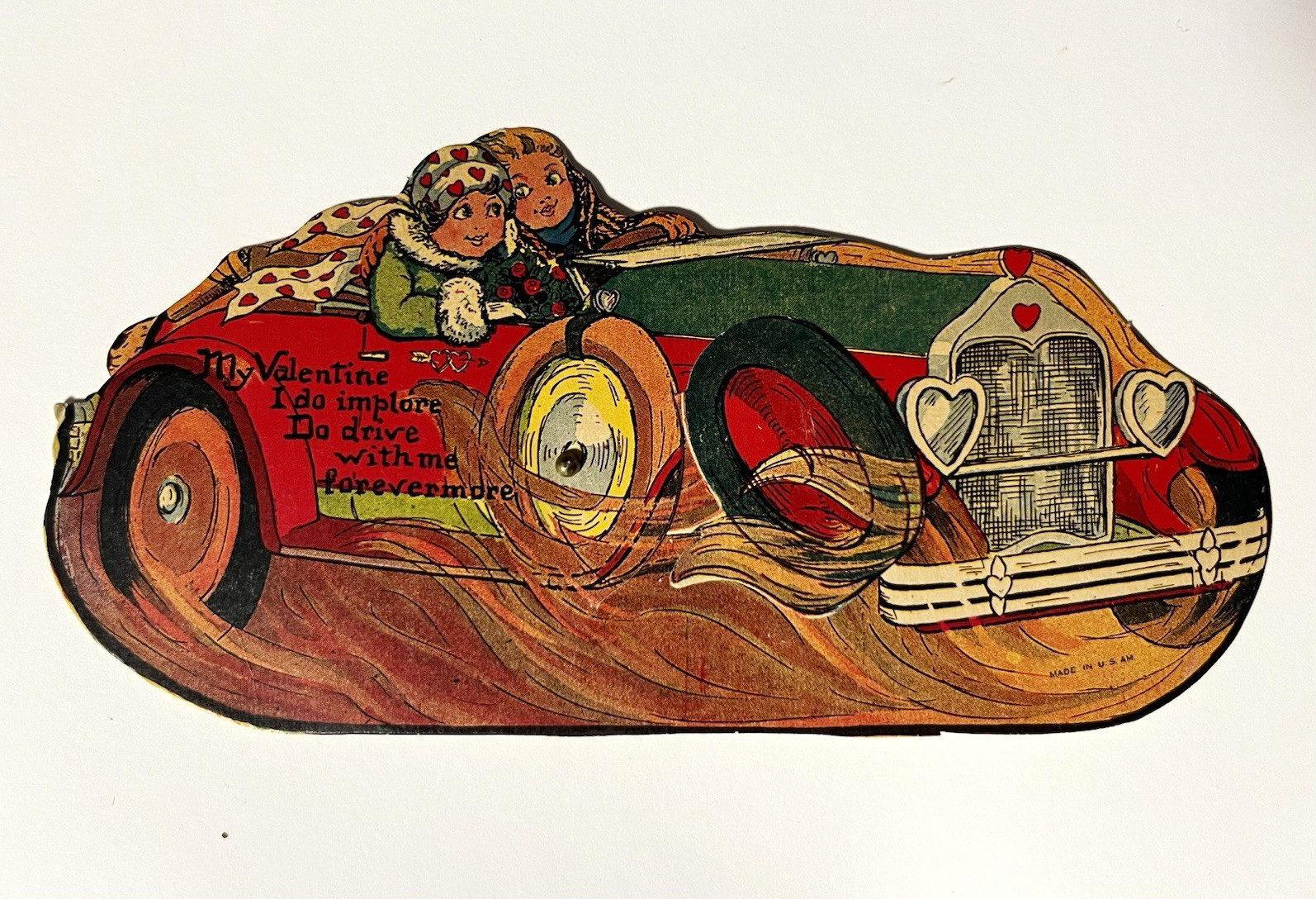 Mechanical vintage valentine card couple in car racing with cupid