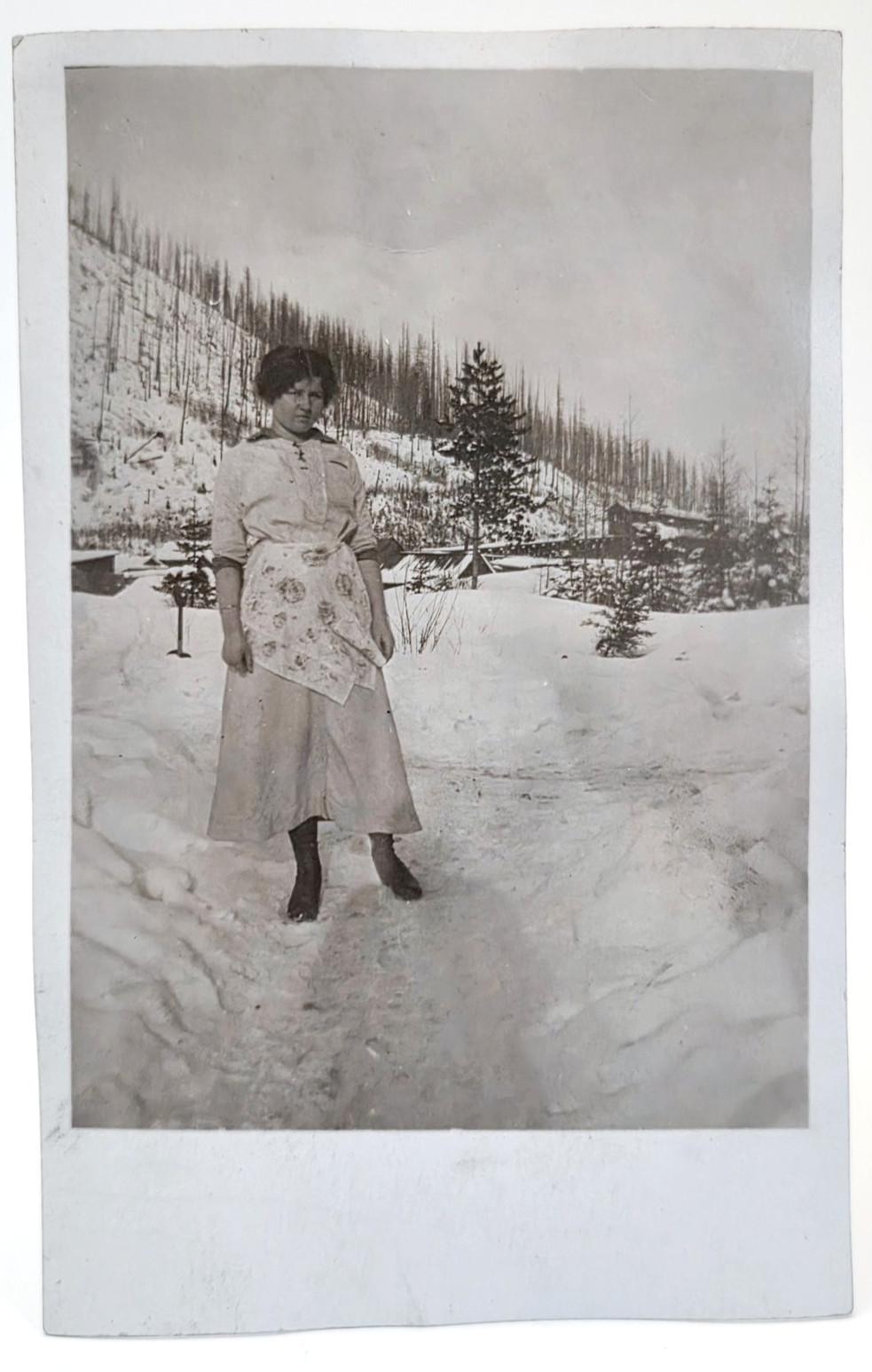 Kalispell Montana | RPPC Postcard Woman in Snow Logging Timber | Hileman