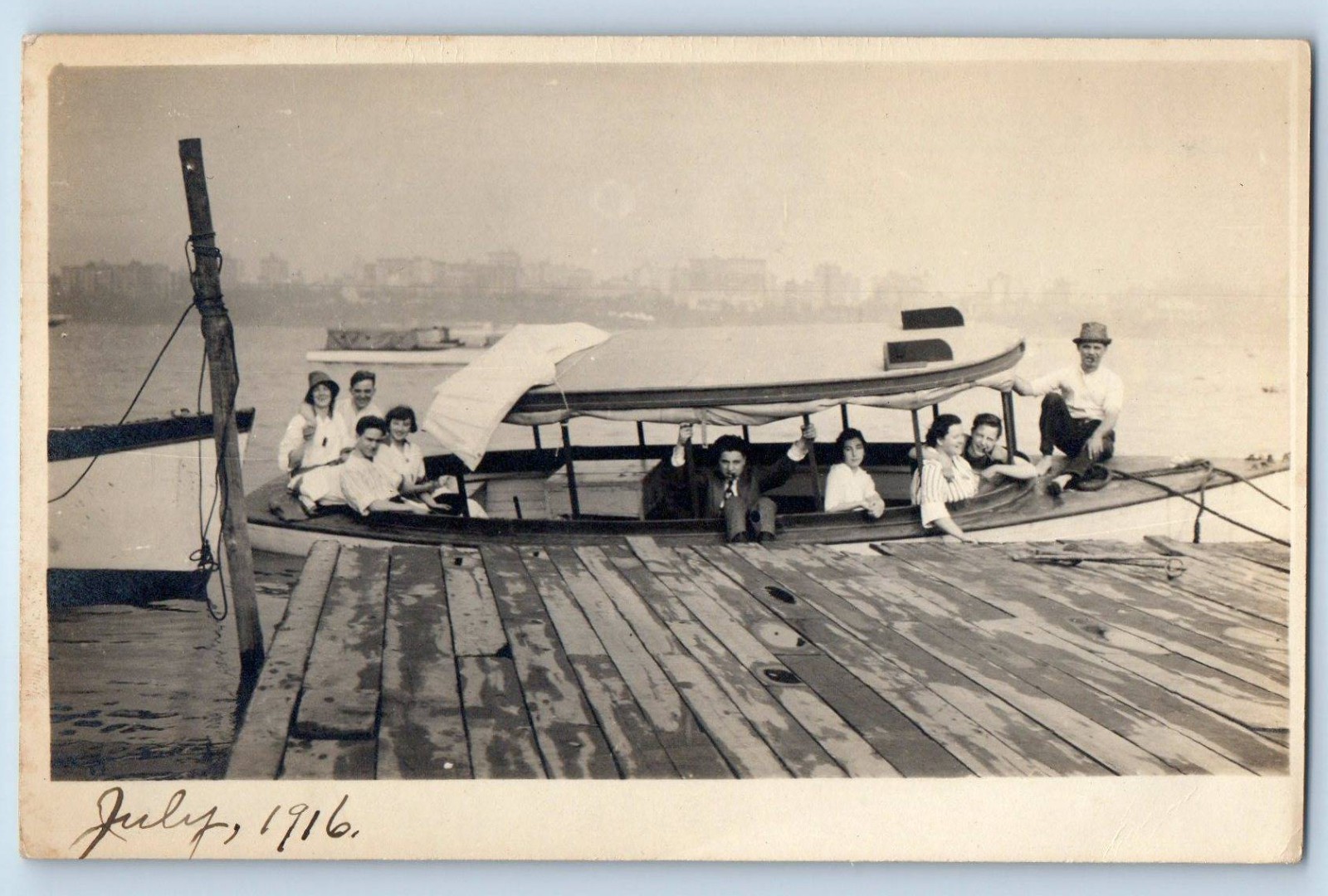 c1910\'s Men And Women Riding Boat Ship River City Skyline RPPC Photo Postcard c1910\'s Men And Women Riding Boat Ship River City Skyline RPPC Photo Postcard