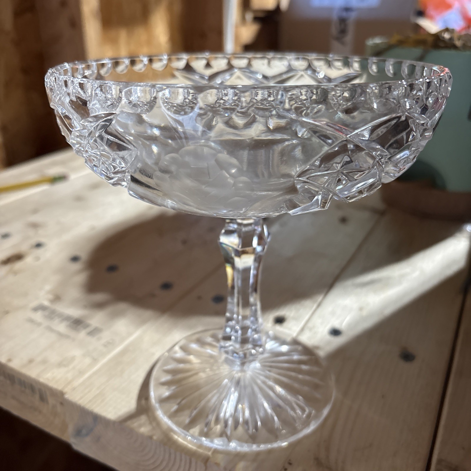 This is a pedestal crystal compote- wheel-cut frosted, etched roses.