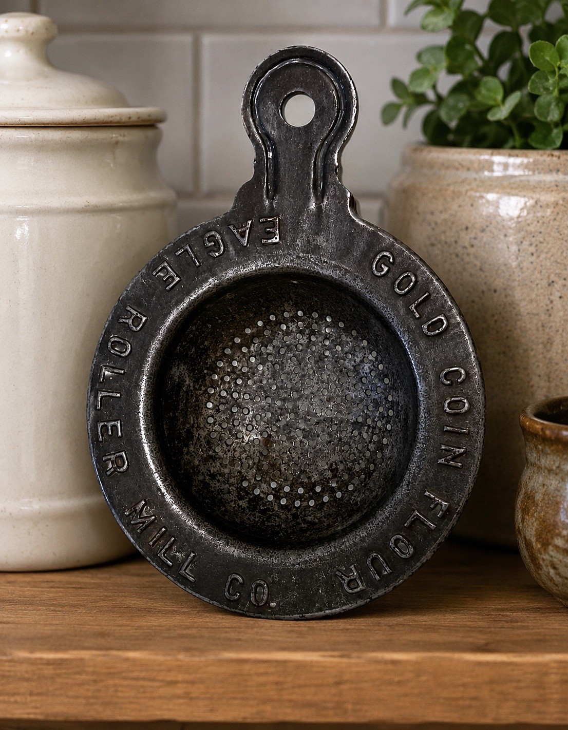 GOLD COIN FLOUR TIN METAL STRAINER.  RAISED LETTERS.  PROMOTIONAL ADVERTISING