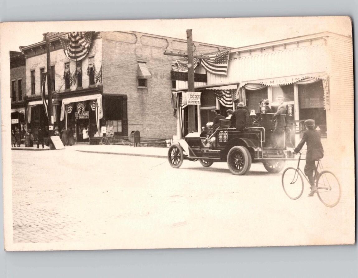 c1910 Fire Truck Driving Street Scene Boy Bicycle Dowagiac Michigan MI RPPC Post