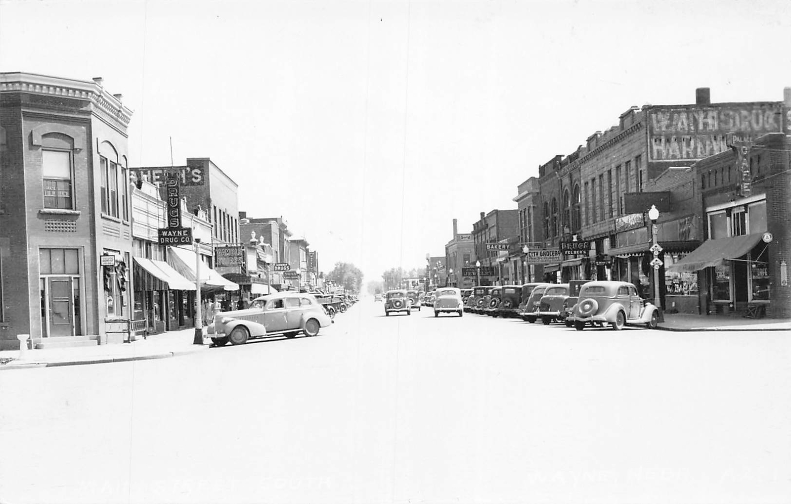 J73/ Wayne Nebraska RPPC Postcard c1940s Main Street Stores 292 J73/ Wayne Nebraska RPPC Postcard c1940s Main Street Stores 292