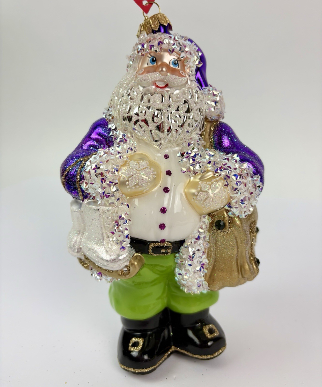 Heartfully Yours Northland Santa Christmas Ornament w/skates Purple Radko 48014