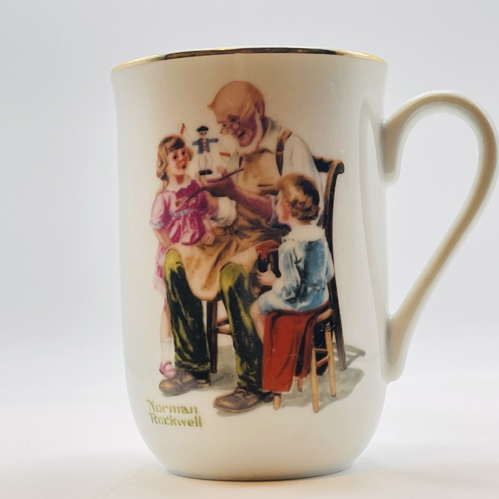 1982 Norman Rockwell  “THE TOYMAKER” Porcelain Gold Rimmed Coffee/Tea Mug 4”