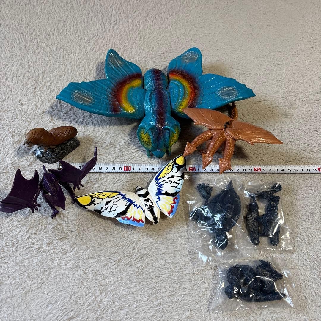 Godzilla figures set including Bullmark, Mothra larva, Gyaos, Rainbow Mothra, Ki